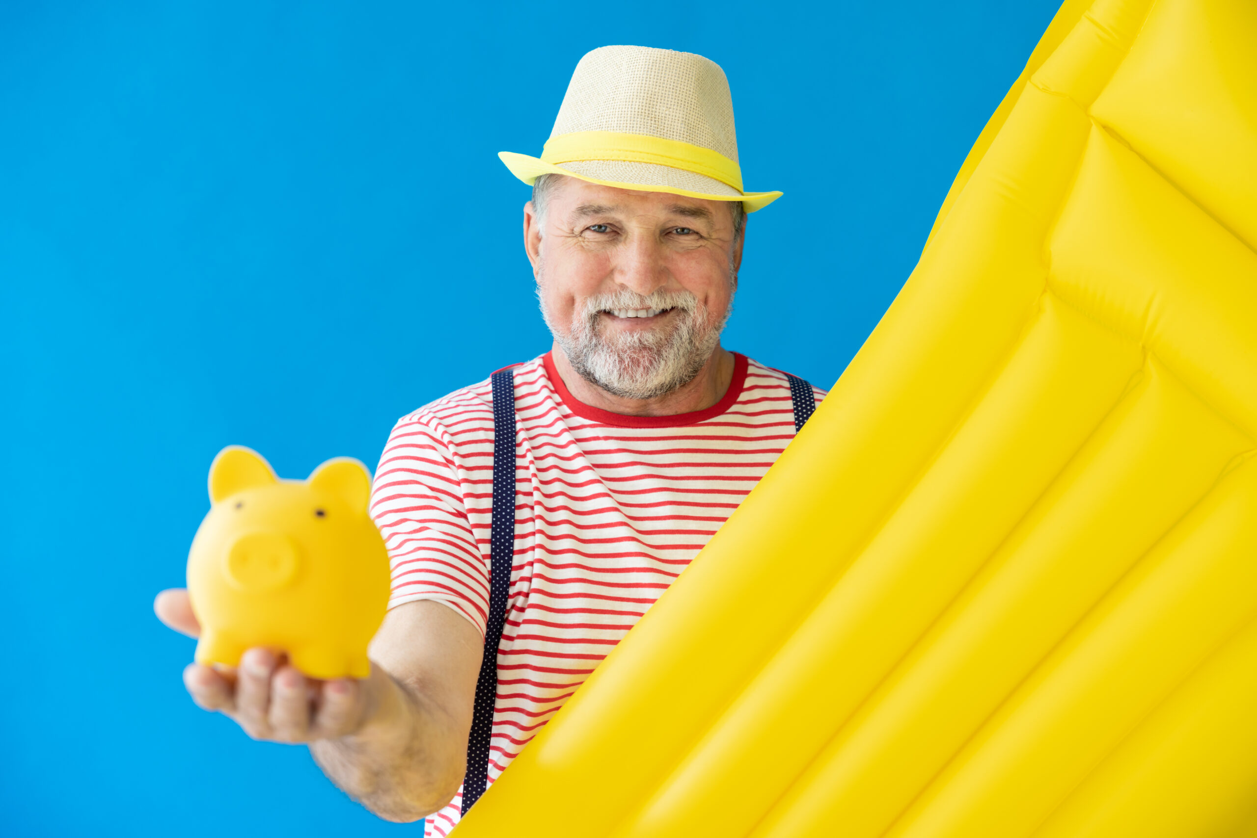 Happy senior man ready to summer vacation. Thanks to his ROTH IRA return.